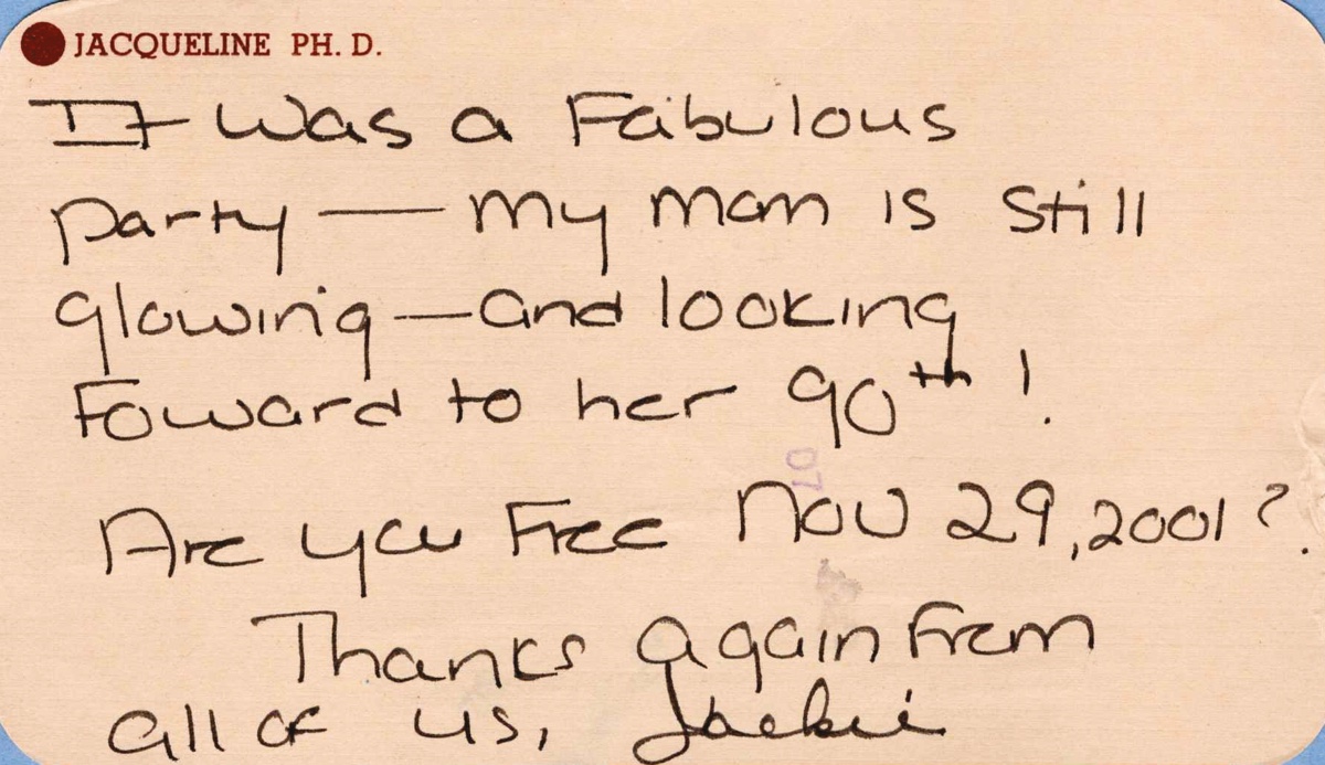 A peach correspondence card written in black felt-tip, signed Jackie. It thanks her for a party and asks whether she is free on a date in 2001.